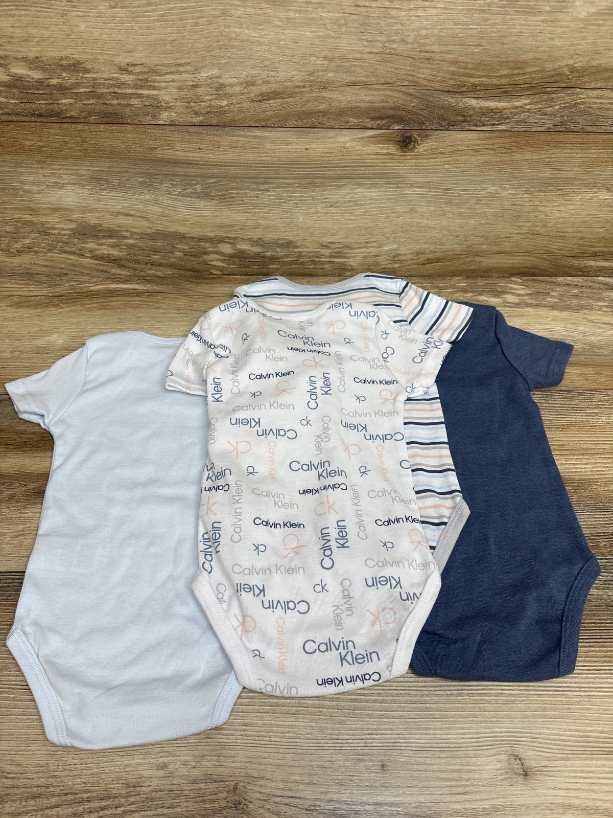 NEW Calvin Klein 4pk Bodysuits Blue sz 12m