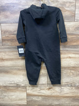 Black baby hooded romper with long sleeves, displayed on wood background, new with tag