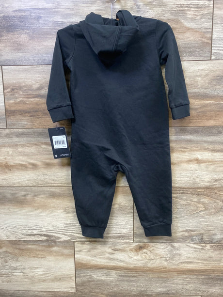 Black baby hooded romper with long sleeves, displayed on wood background, new with tag