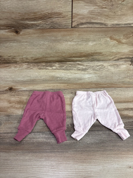 Front view of Child Of Mine 2pk pointelle pants in pink, showcasing two pairs on a wood floor