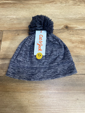 Cat & Jack gray knit pom pom beanie hat with brand tag on wooden surface