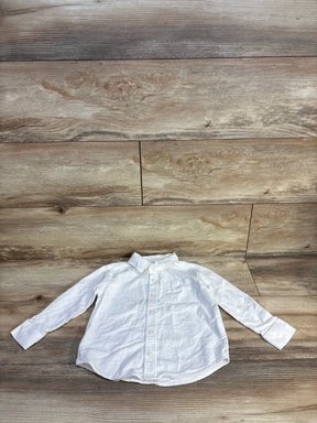 White long sleeve button-down shirt for kids on wood floor, kids clothing resale