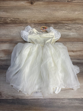 White lace short sleeve toddler dress with tulle skirt on wooden background
