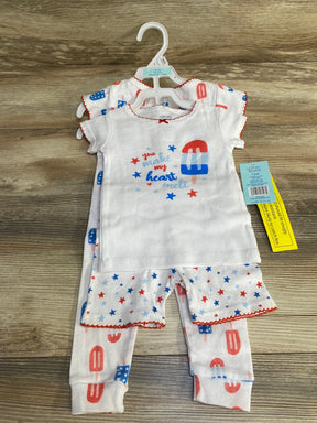 Front view of white 4-piece baby pajama set (12M) showcasing a short-sleeve top printed 'you make my heart melt' and star-and-popsicle pants on a wood surface