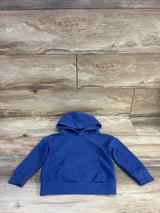 Flat lay of Wonder Nation blue pullover hoodie size 2T showing hood, kangaroo pocket and ribbed cuffs on wood background