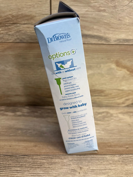Side view of NEW Dr Brown's Anti-Colic Narrow Bottles 8oz 2pk in original Options+ Natural Flow box with vent-system feature copy on wood plank floor