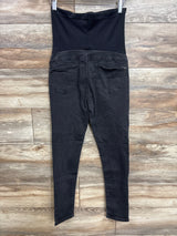 Black maternity jeans with over-the-belly panel, back view on hanger