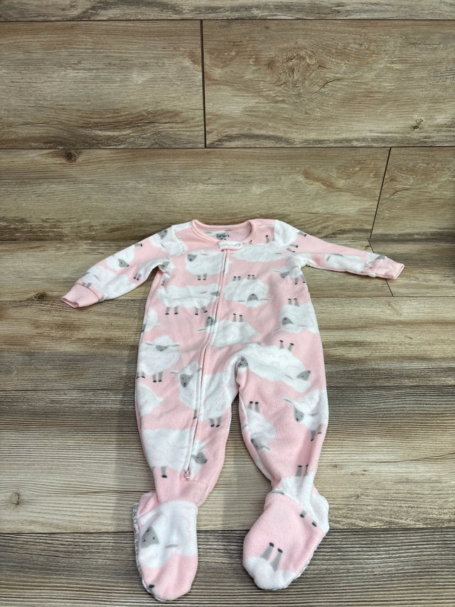 Pink Carter's blanket sleeper for babies with white sheep print on wood background
