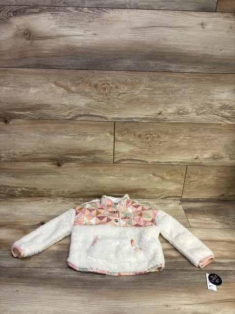 Front view of a white Nicole Miller faux-fur Henley jacket with patterned yoke and trim on a wood background