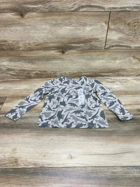 Flat lay of grey Old Navy long-sleeve toddler T-shirt with dark dinosaur print and visible 4T size tag on wood background