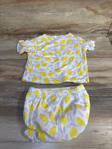 Flat lay of Cat & Jack 2-piece lemon-print ribbed shirt and bloomer set showing ruffle sleeves and elastic waist on wood background