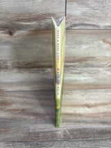 Spine of children's book titled A Kite for Melia by Narh & Narh Suria on wooden surface