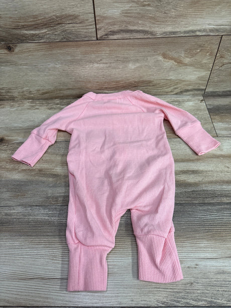 Fable & Ford pink waffle knit baby coverall laid flat on a wooden background
