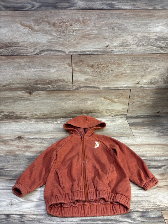 Front view of Old Navy rust zip hoodie, size 2T, with hood, full-length zipper, and front pockets on wood-look background