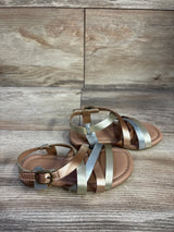 Angled view of Old Navy metallic strappy sandals, bronze and silver straps, ankle buckle on wood background, size 7C