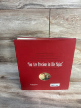 Back cover of children's book with red cover, inspirational text, and illustrated inset.