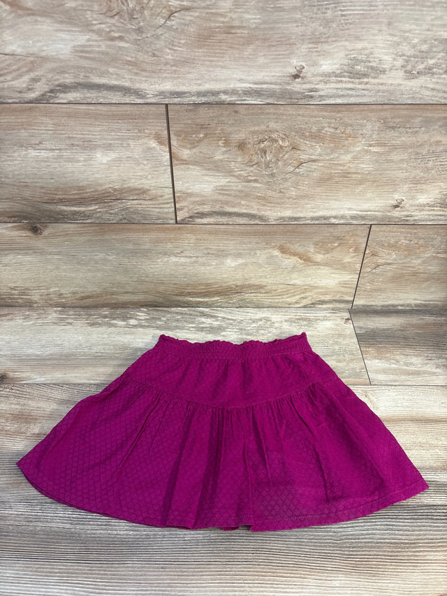 Flat lay of Epic Threads purple tiered toddler skirt size 5-6T showing elastic waistband and subtle diamond texture on wood background