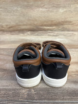 Rear view of Carter's toddler brown and black casual sneakers, size 6C, showing cushioned grey lining and white rubber soles on wood background