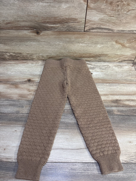 Front view of Jamie Kay Hope knit pants in brown showcasing ribbed cuffs and textured knit on a wood-look background