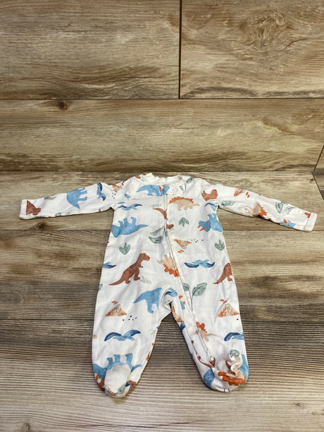 Front view of Carter’s ivory sleeper showcasing long sleeves, footed legs, and dinosaur print on a wood floor