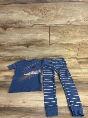 Blue children's outfit with dinosaur print t-shirt and blue striped leggings on wooden floor