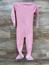 Full view of Carter’s unicorn sleeper, pink size 3T, with long sleeves, covered feet, and star print on wood background