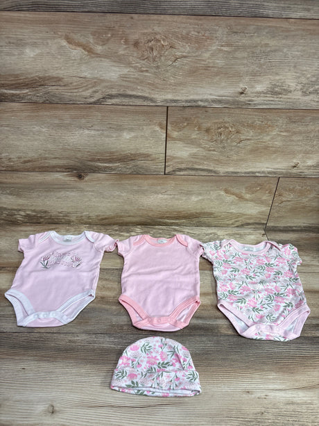 Front view of Little Beginnings 4pc bodysuits set showing three pink bodysuits and a matching floral cap on wood background