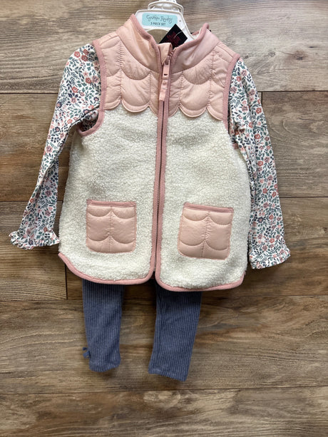 Front view of Cynthia Rowley 3-piece toddler set showcasing pink sherpa vest, floral shirt, and ribbed pants on wood