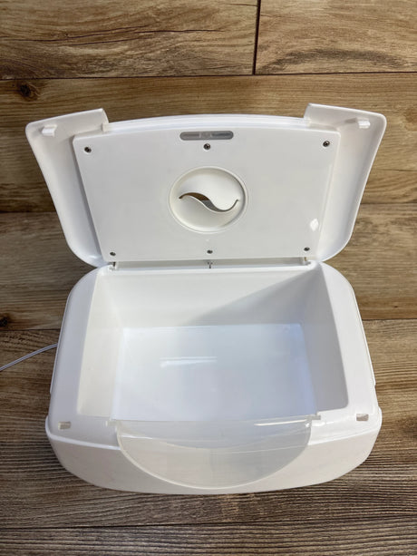 White baby wipe warmer with open lid on wood surface, ideal for nursery or diaper changing station