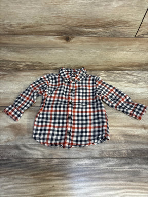 Plaid long sleeve button up shirt for kids with red, black, and white check pattern