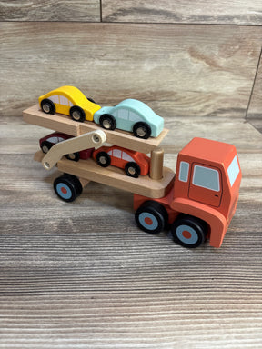 Wooden toy car carrier truck with colorful mini cars on wood background