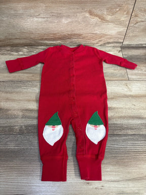 Red baby onesie with festive gnome faces on legs, perfect for holiday outfits and baby gear.