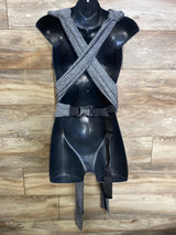 Front view of Boppy ComfyFit Hybrid baby carrier showing crossed grey padded shoulder straps and waist buckle on black mannequin against wood floor