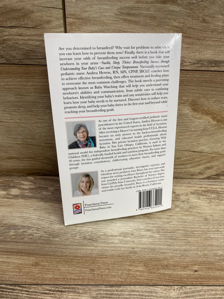 Back cover of Suckle, Sleep, Thrive paperback book showing breastfeeding guidance and author biographies