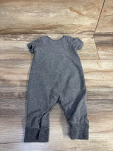 Flat-lay back view of grey Disney Baby Mickey Mouse jumpsuit, short sleeves, snap leg closures, cuffed ankles on wood floor