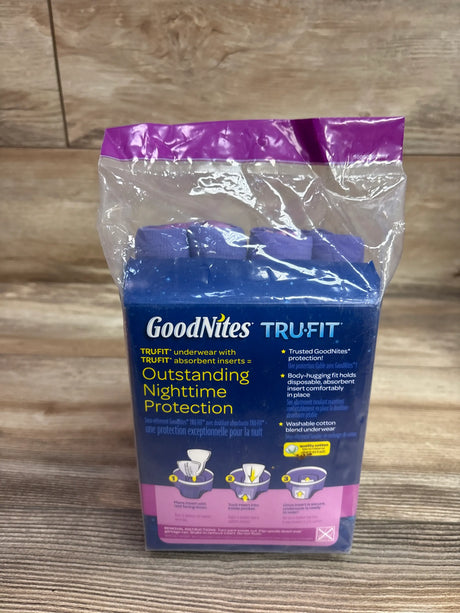 Front view of GoodNites Tru-Fit Girls Starter Pack with underwear and disposable inserts in clear packaging on a wood surface