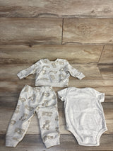 Baby boy 3-piece set with teddy bear print long sleeve top, pants, and plain onesie on wood floor