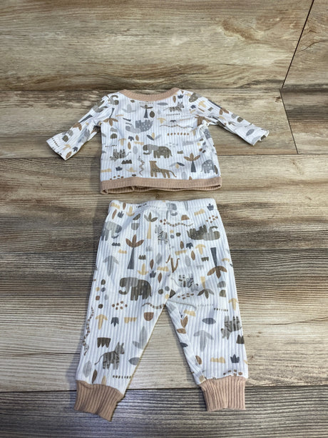 Flat lay of DreamGro 2-piece ribbed kimono pajama set in white with gray and tan animal print and tan cuffs on wood background