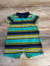 Striped short sleeve baby romper with collar, blue, green and yellow, laid on wood