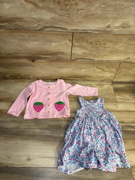 Pink strawberry cardigan and floral sundress for toddler on wood floor, resale kids clothes