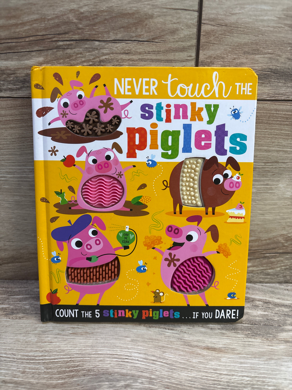 Never Touch The Stinky Piglets Board Book