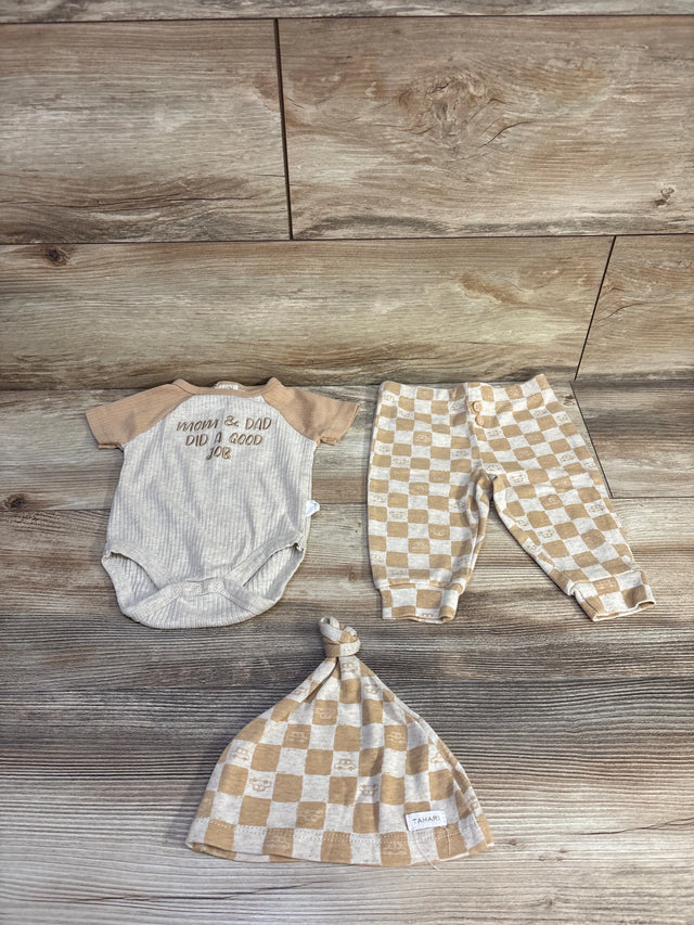 Flat lay of beige ribbed 3-piece set: bodysuit, checkered pants, and knotted hat with ribbed texture and snaps on wood floor