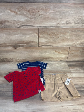 Toddler boy outfit set with red anchor shirt, blue striped shirt, and khaki shorts on wood floor