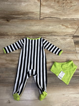 Black and white striped baby onesie with lime green accents and matching bib on wood floor