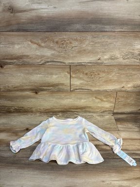 Long sleeve pastel tie-dye baby peplum top with tag on wood background