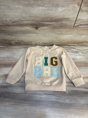 Beige toddler sweatshirt with colorful BIG BRO letters on wood background, kids clothing