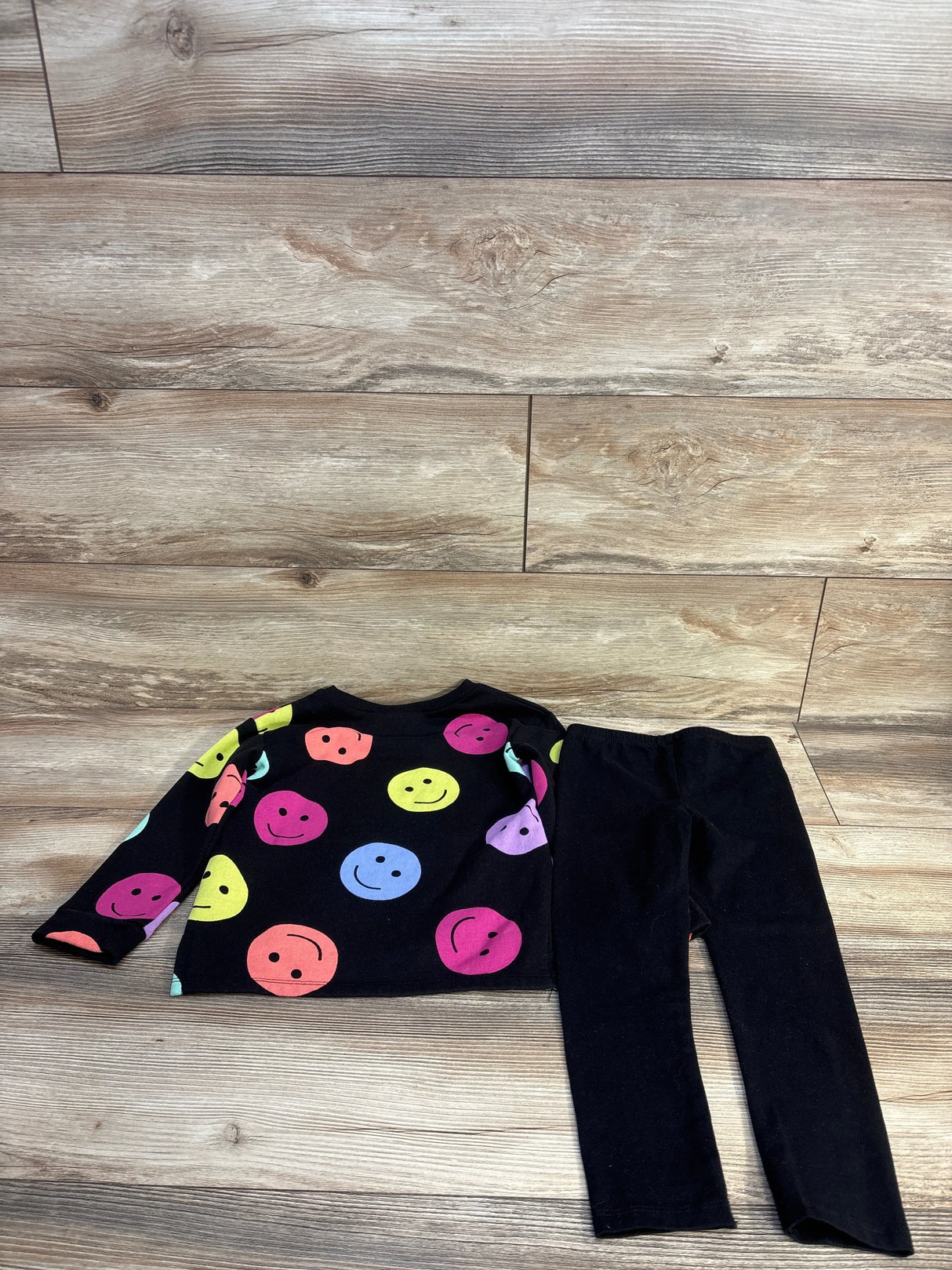 Kids black long sleeve shirt with colorful smiley faces and matching black leggings