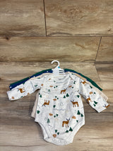 Front view of 4 long-sleeve baby bodysuits, grey deer-print bodysuit on top, snap closures visible, on wood floor background