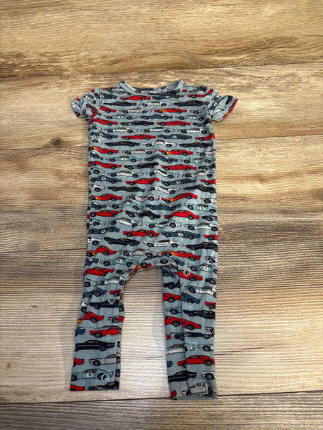Gray baby romper with red, black, and white car print, short sleeves, wood background