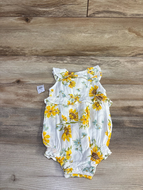 Front view of NEW Old Navy Sleeveless Ruffle-Trim Smocked Bubble Romper in white size 12-18m showcasing yellow sunflower print with ruffle bodice on wood plank floor